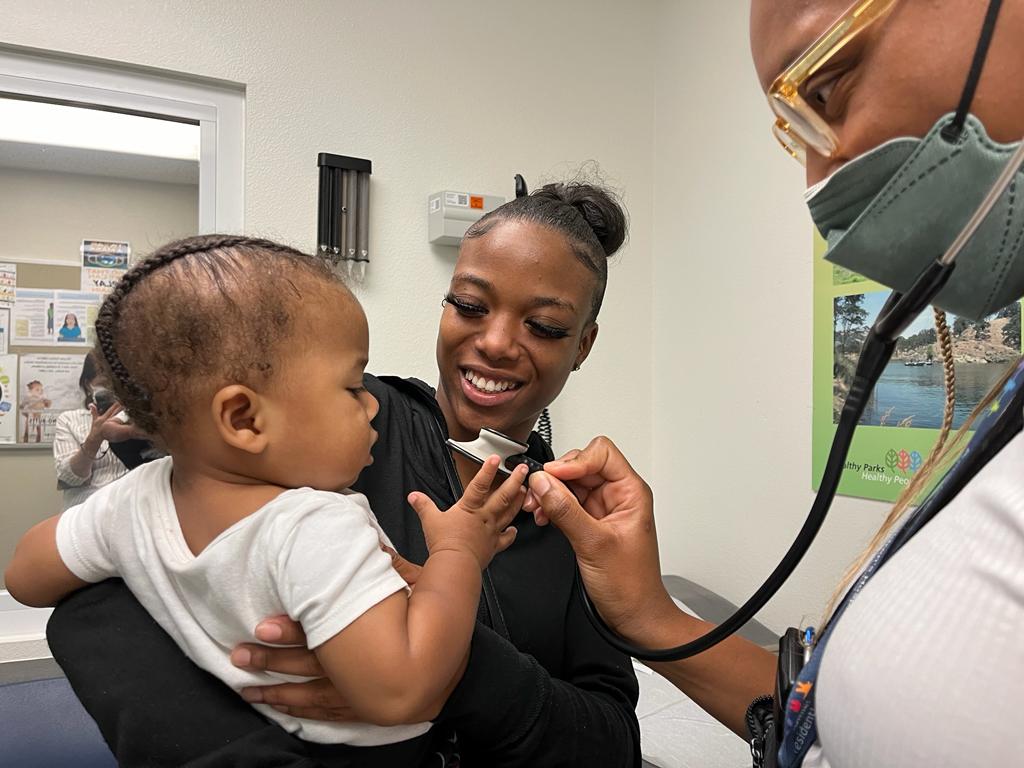 BLOOM Resident, Dr. Jasmine Solola, working with a BLOOM family.