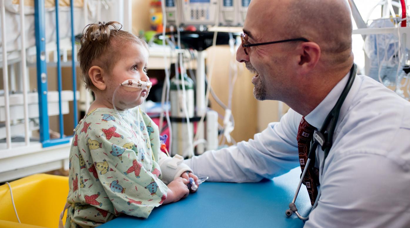 Doctor helping a small toddler 