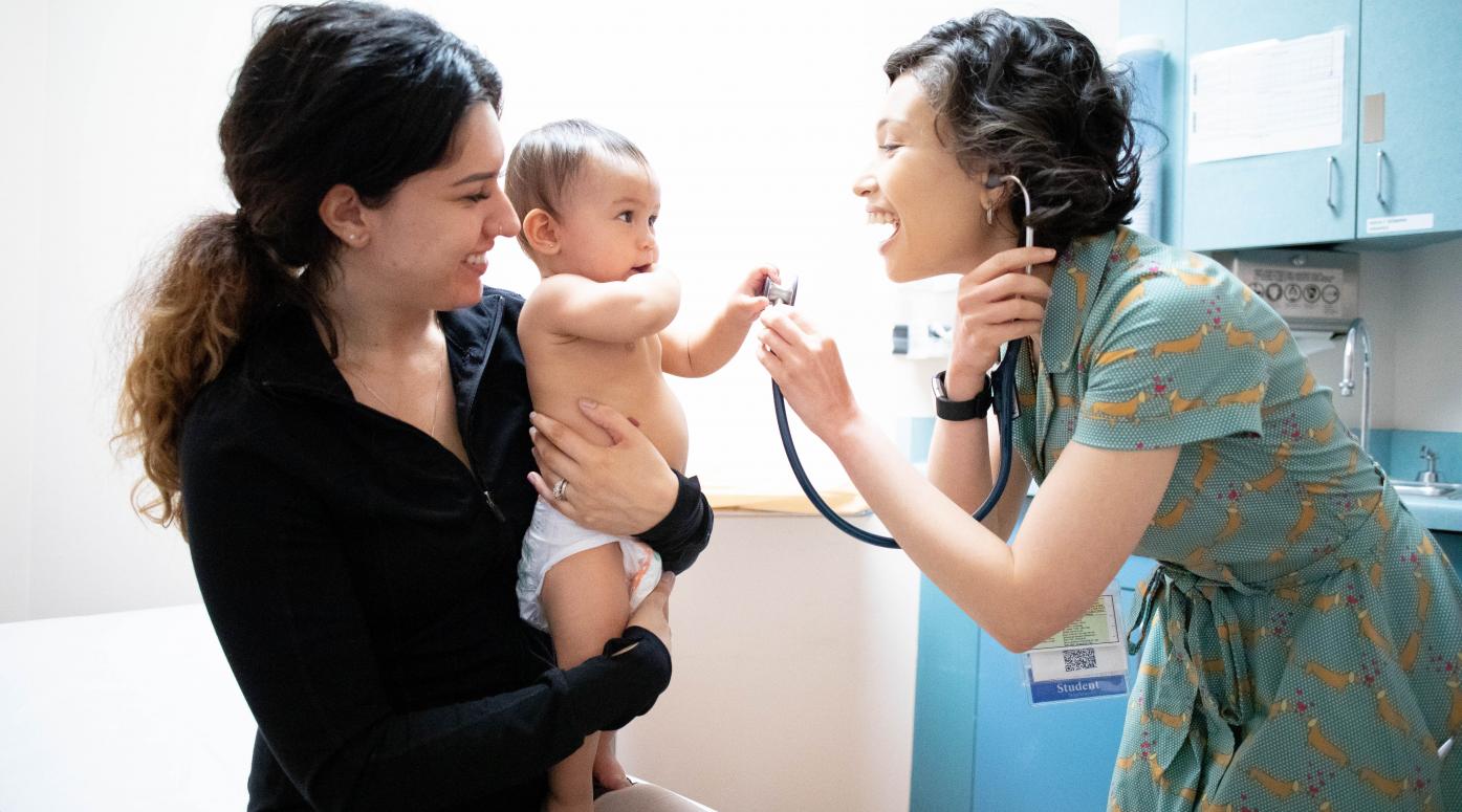 Pediatrician examines baby 