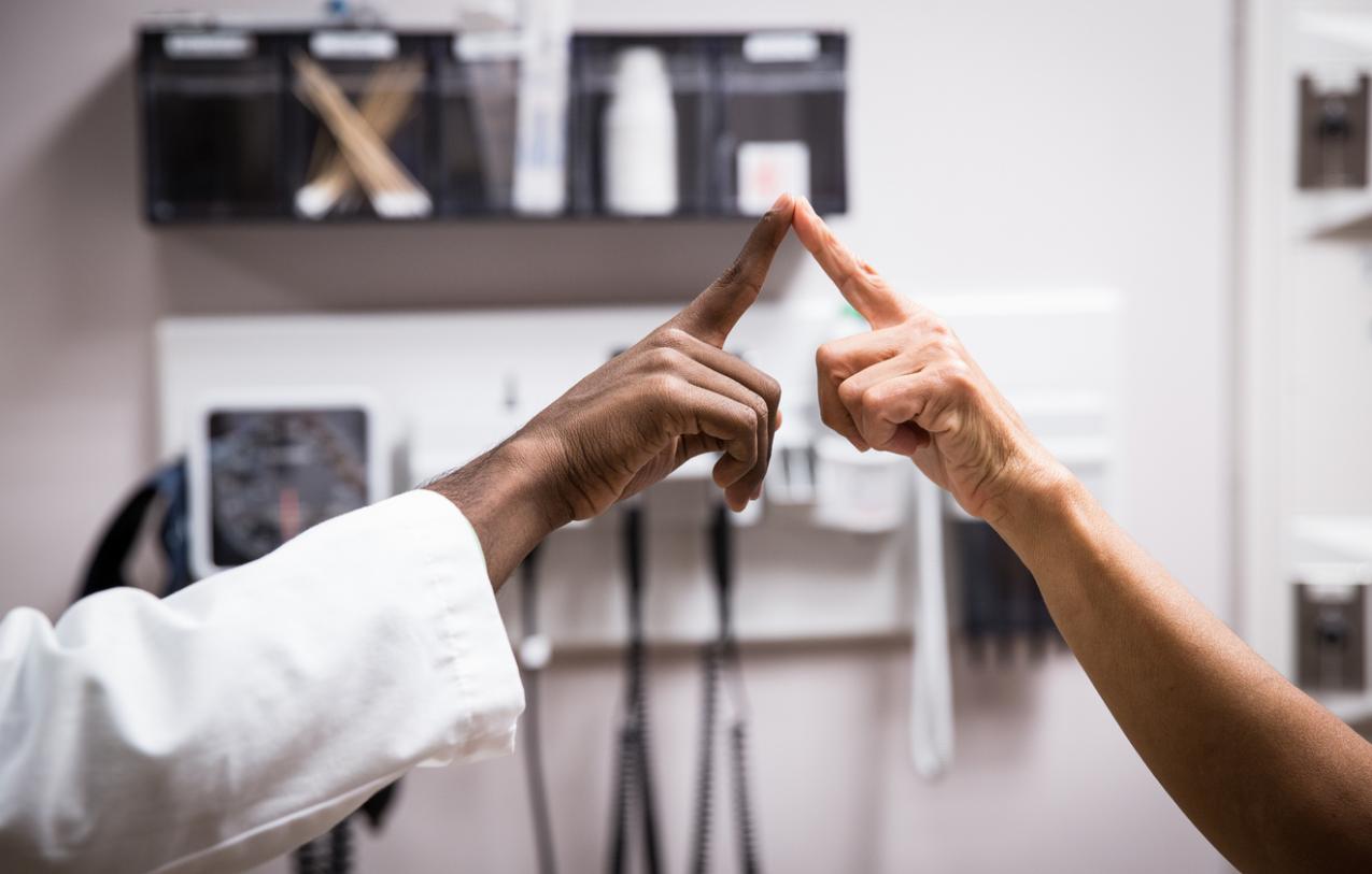 Doctors touch fingers