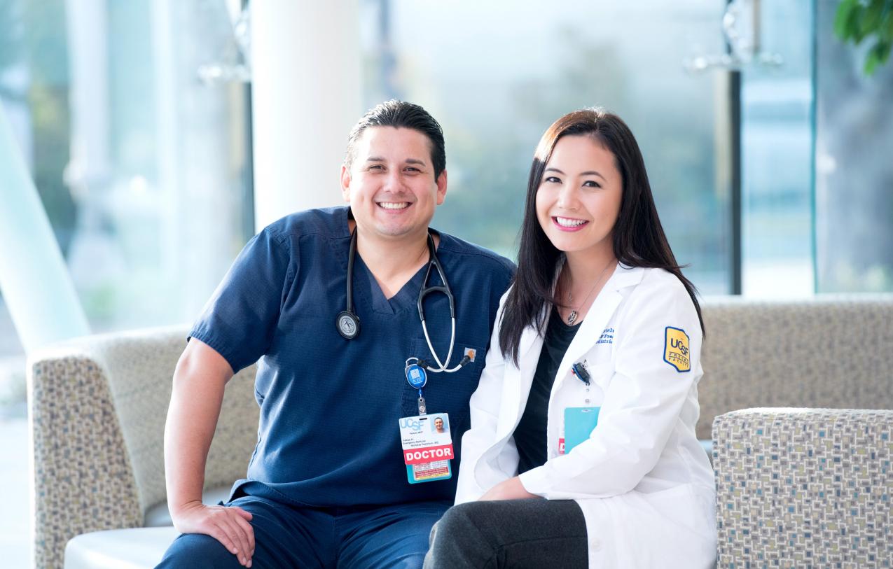 Doctor and fellow sit on a couch 