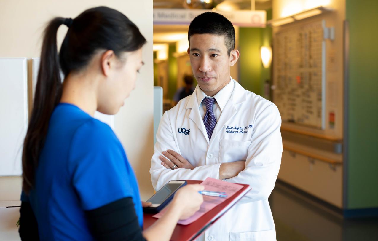 Doctor speaking with nurse