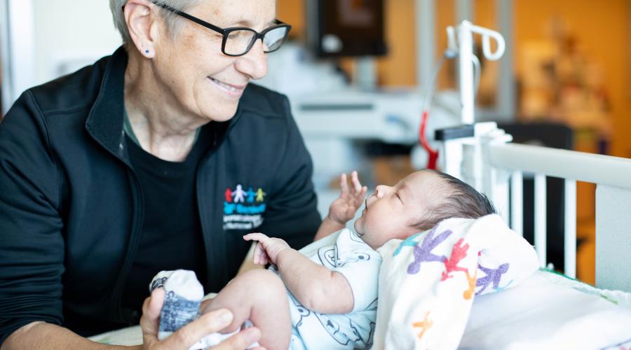 Doctor holding baby