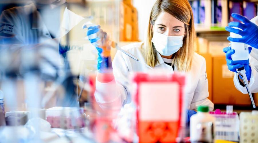 A scientist performs research in a lab