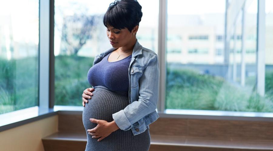 A pregnant woman in a hospital lobby