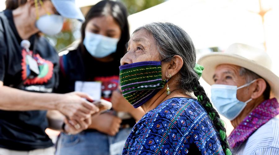 A Guatemalan family receives medical care at an outdoor clinic