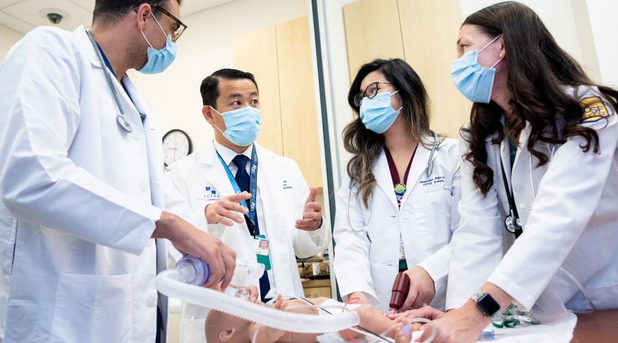 Physicians and nurses train together on a high-fidelity mannikin