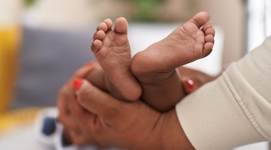 An infant's feet after having blood drawn for newborn screening